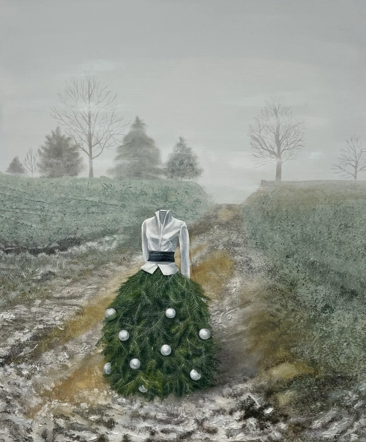 A misty winter landscape with bare trees and a headless figure wearing a white jacket and an evergreen skirt decorated with pearls.
